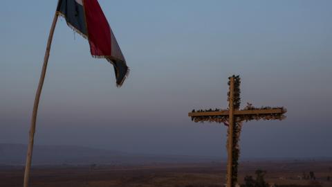 A cross is seen on a hillside overlooking the NPU (Nineveh Plain Protection Units) checkpoint on November 8, 2016 in Qaraqosh, Iraq. (Chris McGrath/Getty Images)