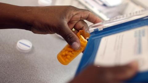 Rosemary Petty, a Publix Supermarket pharmacy technician, counts out a prescription of antibiotic pills August 7, 2007 in Miami, Florida. (Joe Raedle/Getty Images)