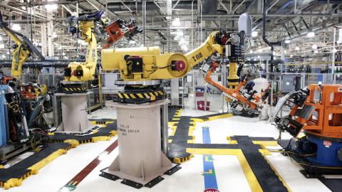 Robots at the Fiat Chrysler Automobiles US Warren Stamping Plant are shown January 22, 2016 in Warren, Michigan. (Bill Pugliano/Getty Images)