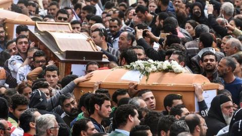 Mourners carry the coffins of the victims of the blast at the Coptic Christian Saint Mark's church in Alexandria on April 10, 2017. (MOHAMED EL-SHAHED/AFP/Getty Images)