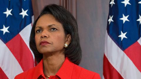 US Secretary of State Condoleezza Rice listens as US President George W. Bush speaks prior to signing HR 7222, Washington, DC, October 16, 2008 (SAUL LOEB/AFP/Getty Images)