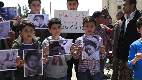 Survivors of chemical gas attack gather to protest Assad regime at the Khan Shaykhun town's square in Idlib, Syria, April 7, 2017 (Firas Faham/Anadolu Agency/Getty Images)