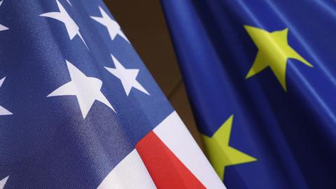 The U.S. and E.U. flags hang at the W20 conference on April 25, 2017 in Berlin, Germany (Sean Gallup/Getty Images)