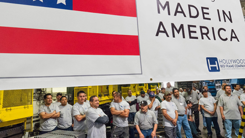 Workers at the Hollywood Bed Frame Company attend an event to mark the company's upcoming expansion, April 14, 2017 (ROBYN BECK/AFP/Getty Images)