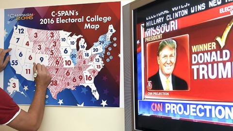 Jake Krupa colors in an electoral map at an election watching party in Coconut Grove, Florida, November 8, 2016 (RHONA WISE/AFP/Getty Images)