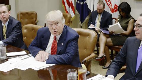 U.S. President Donald Trump discusses the federal budget as Treasury Secretary Steve Mnuchin (R) looks on, February 22, 2017 (Olivier Douliery-Pool/Getty Images)