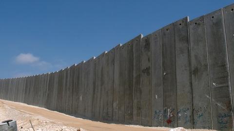 Israel's "Security Fence" is a solid wall along 5% of it's length. 10 meters high and reinforced concrete (Justin McIntosh)
