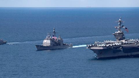 The Arleigh Burke-class guided-missile destroyer USS Michael Murphy and Ticonderoga-class guided-missile cruiser USS Lake Champlain move alongside the aircraft carrier USS Carl Vinson in the Indian Ocean, April 14, 2017 (U.S. Department of Defense)