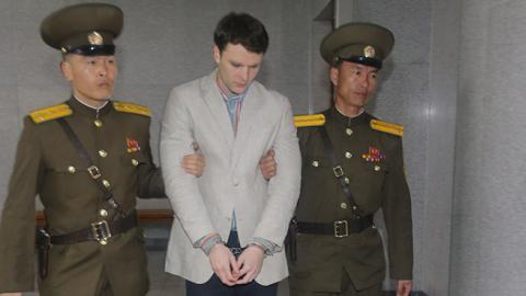 Otto Warmbier arrives at a court for his trial in Pyongyang, North Korea, March 16, 2015 (Xinhua/Lu Rui via Getty Images)