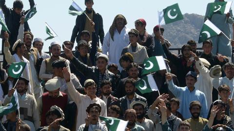 Pakistani tribesmen carry national flag during a Pakistan National Day in North Waziristan, March 23, 2017 (ABDUL MAJEED/AFP/Getty Images)