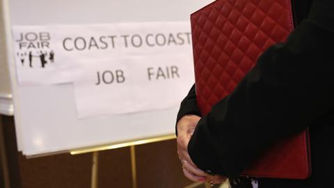 A woman waits to meet potential employers at a job fair on September 13, 2016 in Hartford, Connecticut (John Moore/Getty Images)