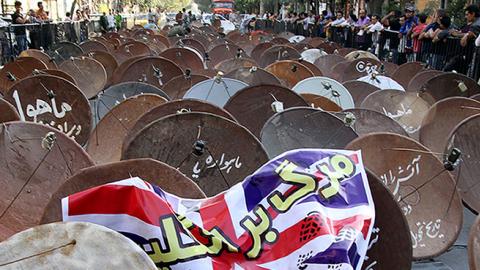 Satellite dishes displayed in street of the city of Shiraz before being destroyed by the Iranian army, September 28, 2013 (MOHSEN TAVARO/AFP/Getty Images)
