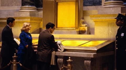 People viewing the Constitution and Declaration of Independence in the National Archives exhibition hall (Bettmann Collection)