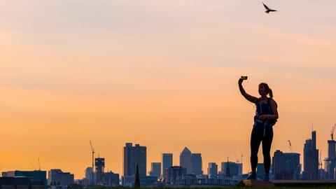 A woman takes a selfie on Primrose Hill, London, August 16, 2017 (Paul Davey / Barcroft Images / Barcroft Media via Getty Images)