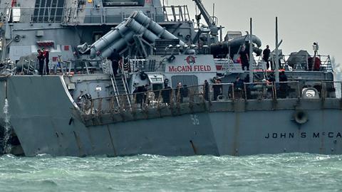  USS John S. McCain, with a hole on its portside after a collision with an oil tanker, August 21, 2017 (ROSLAN RAHMAN/AFP/Getty Images)