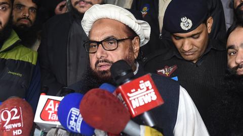 Hafiz Saeed, the Pakistani leader of Jamaat-ud-Dawa, speaks to the press after being placed under 'preventative detention' by Pakistan, January 31, 2017 (ARIF ALI/AFP/Getty Images)