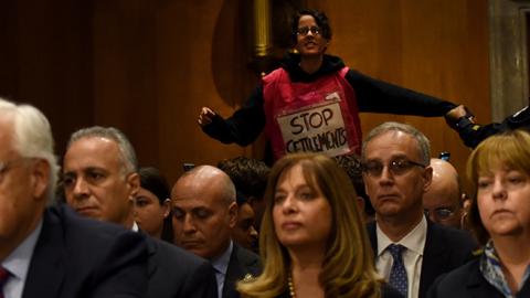 Anti-settlements demonstrator interrupts David Friedman at a hearing in front of the Senate Committee on Foreign Relations, February 16, 2016 (Robinson Chavez/The Washington Post via Getty Images)