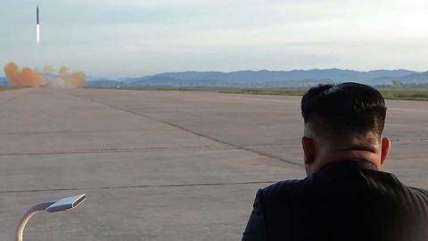 North Korean leader Kim Jong-Un inspecting a launching drill of the medium-and-long range strategic ballistic rocket Hwasong-12, September 16, 2017 (STR/AFP/Getty Images)
