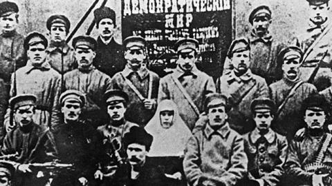 Bolshevik fighters pose with their guns in Petrograd, October 1917 (AFP/Getty Images)