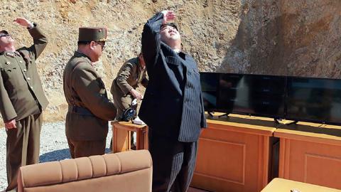 North Korean leader Kim Jong-Un inspecting the successful test-fire of the intercontinental ballistic missile Hwasong-14 (STR/AFP/Getty Images)