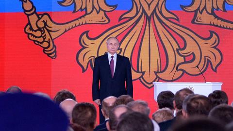 Russian President Putin stands addressing the Federal Assembly in Moscow, March 1, 2018 (ALEXEY NIKOLSKY/AFP/Getty Images)