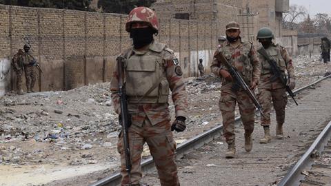 Pakistani paramilitary soldiers patrol near the site of an attack by gunmen on policemen in Quetta, February 14, 2018 (BANARAS KHAN/AFP/Getty Images)