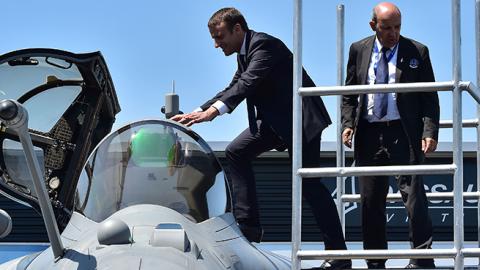 President Macron boards a Dassault Rafale fighter jet at the International Paris Air Show, June 19, 2017 (CHRISTOPHE ARCHAMBAULT/AFP/Getty Images)