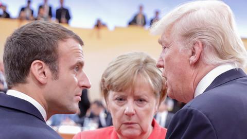 President Trump, Chancellor Merkel, and President Macron at the G20 meeting in Hamburg, July 7, 2017 (KAY NIETFELD/Getty Images)