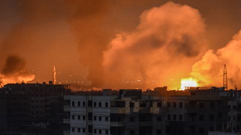 April 28, 2018 explosions appearing in the skyline of a southern district of the Syrian capital Damascus, during regime strikes targeting the Islamic State group in the Palestinian camp of Yarmuk, and neighbouring districts.