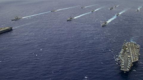 Ships from the George Washington and Carl Vinson Carrier Strike Groups steam in formation at the conclusion of Valiant Shield 2014. (U.S. Navy/Mass Communication Specialist 3rd Class Paolo Bayas/Released)