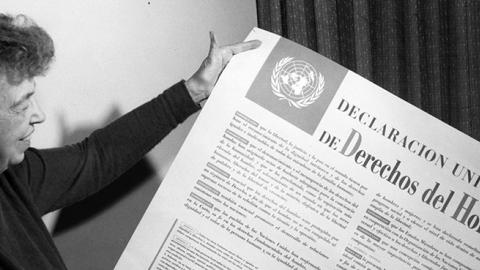 Eleanor Roosevelt displays a Spanish language version of the Universal Declaration 1949 (Universal History Archive/UIG via Getty Images)