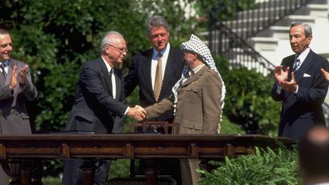 Yitzak Rabin and Yassir Arafat shake hands after signing the peace accord between Israel and the PLO at the White House, September 13, 1993 (Richard T. Nowitz/CORBIS/Corbis via Getty Images)