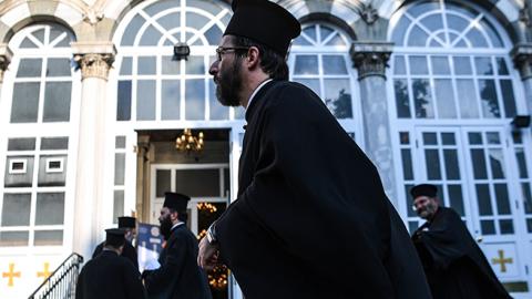 Orthodox officials are seen outside the Hagia Triada Greek Orthodox church on September 1, 2018 in Istanbul. (Photo credit should read OZAN KOSE/AFP/Getty Images)
