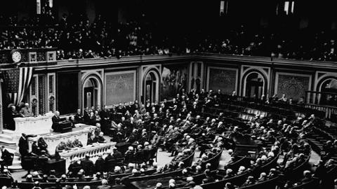 President Woodrow Wilson reads the armistice terms that ended World War I to Congress, Nov. 11, 1918. (Photo Credit: Corbis via Getty Images.)