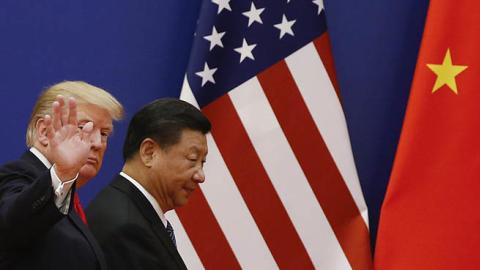 U.S. President Donald Trump and China's President Xi Jinping meet business leaders at the Great Hall of the People on November 9, 2017 in Beijing, China. (Photo by Thomas Peter-Pool/Getty Images)