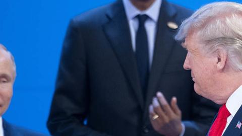 Donald Trump looks at Vladimir Putin at the meeting center of the G20 summit in Buenos Aires on November 30, 2018 (Photo by Ralf Hirschberger/picture alliance via Getty Images)