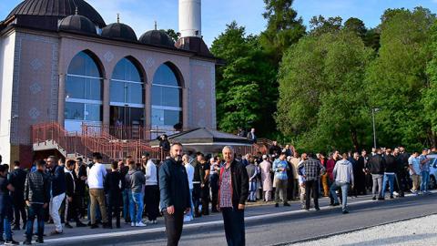 People arrive to perform Eid al-Fitr prayer in Stockholm, Sweden on June 15, 2018. (Photo by Atila Altuntas/Anadolu Agency/Getty Images)