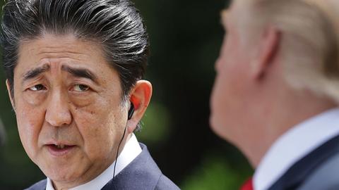 Japanese Prime Minister Shinzo Abe looks at U.S. President Donald Trump at a joint news conference in the Rose Garden at the White House June 7, 2018 in Washington, DC. (Chip Somodevilla/Getty Images)