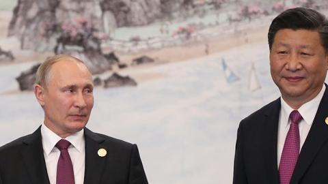 Russian President Vladimir Putin with Chinese President Xi Jinping during a welcoming ceremony prior to the dinner on September 4, 2017 in Xiamen, China. (Mikhail Svetlov/Getty Images)