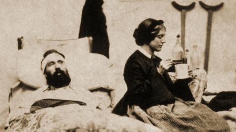 Two wounded Federal soldiers being cared for by a nurse during the Civil War. (PHOTO: UNCREDITED)