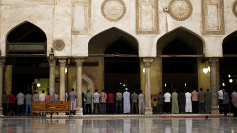 Egyptians perform the sunset prayer after the first fasting day of the Muslim holy month of Ramadan at the Al-Ahzar mosque in Cairo on July 10, 2013. (GIANLUIGI GUERCIA/AFP/Getty Images)