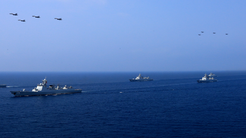  A PLA Navy fleet including the aircraft carrier Liaoning, submarines, vessels and fighter jets take part in a review in the South China Sea on April 12, 2018. (VCG via Getty Images)