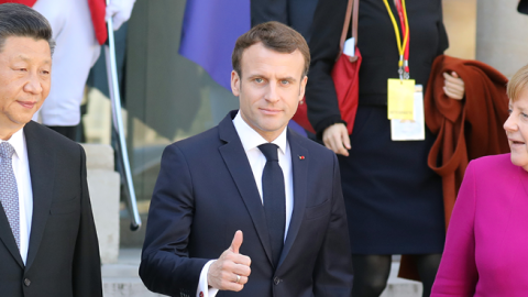 French President Emmanuel Macron (C) gestures next to German Chancellor Angela Merkel (R) and Chinese President Xi Jinping (L) following their meeting at the Elysee Palace in Paris on March 26, 2019. (LUDOVIC MARIN/Getty Images)