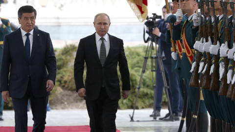 Russian President Vladimir Putin followed by Kyrgyz President Sooronbay Jeenbekov attend the welcoming ceremony prior to their talks in Bishkek, Kyrgyzstan on March 28, 2019. (Mikhail Svetlov/Getty Images)