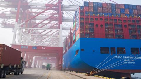 A truck moves a shipping container at Qingdao Port on January 14, 2019 in Qingdao, Shandong Province of China. (VCG/Getty Images)