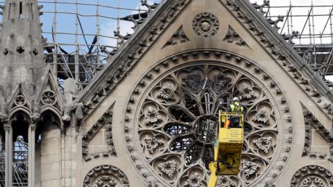 Technicians work in a crane next to Notre Dame cathedral following the massive fire earlier this month, on April 29, 2019 in Paris, France. (Chesnot/Getty Images)