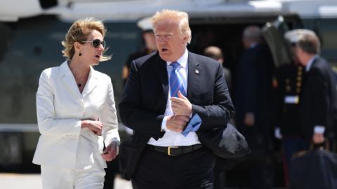 US President Donald Trump, with US Ambassador to Canada Kelly Knight Craft, walks to Air Force One in Canada, June 9, 2018. (SAUL LOEB/Getty Images)