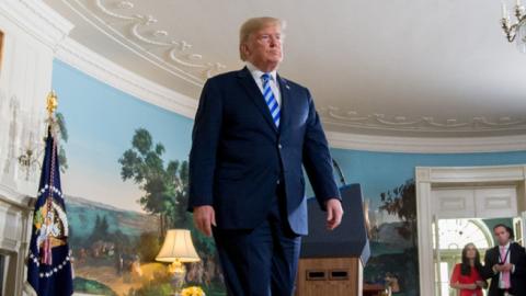 US President Donald Trump leaves after announcing his decision about the nuclear deal with Iran during a speech from the Diplomatic Reception Room at the White House in Washington, DC, May 8, 2018. (SAUL LOEB/Getty Images)