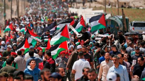 Palestinian demonstrators gather east of Gaza City in the Gaza Strip on May 15, 2019, during a protest marking the 71st anniversary of Nakba. (MAHMUD HAMS/Getty Images)