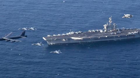 The Abraham Lincoln Carrier Strike Group and a U.S. Air Force B-52H Stratofortress, conduct joint exercises. (U.S. Navy photo/Flikr)